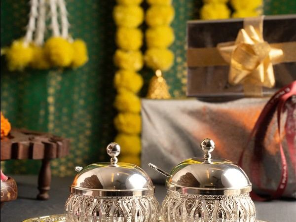 Ekaani silver-plated bowl and tray gift set with marigold Diwali backdrop